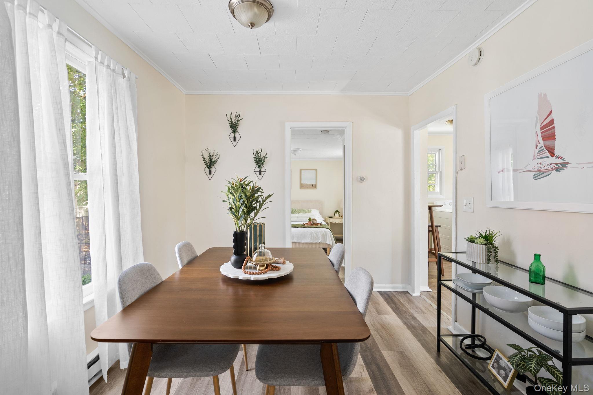 8 Coldenham Road Walden, NY 12586 - Photo 11 of 50 Dining room with wood finished floors, crown molding, and baseboard heating