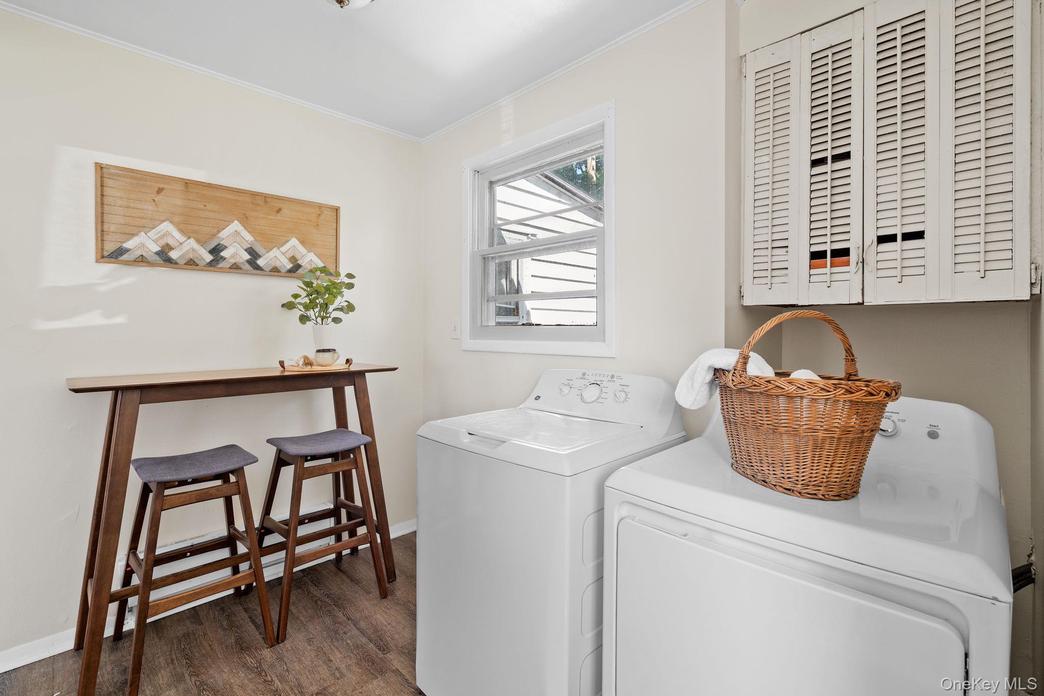 8 Coldenham Road Walden, NY 12586 - Photo 40 of 50 Washroom with ornamental molding, dark wood finished floors, and washer and dryer