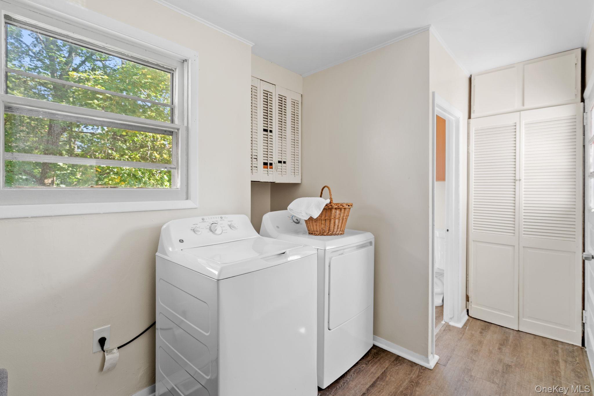 8 Coldenham Road Walden, NY 12586 - Photo 41 of 50 Laundry area with wood finished floors, separate washer and dryer, and ornamental molding