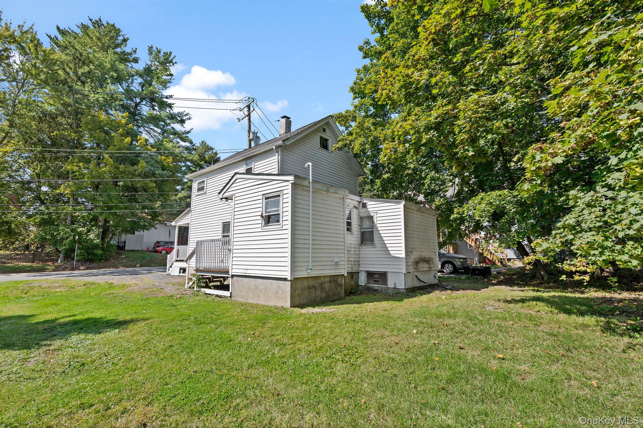 8 Coldenham Road Walden, NY 12586 - Photo 45 of 50 View of side of home with a lawn and a chimney
