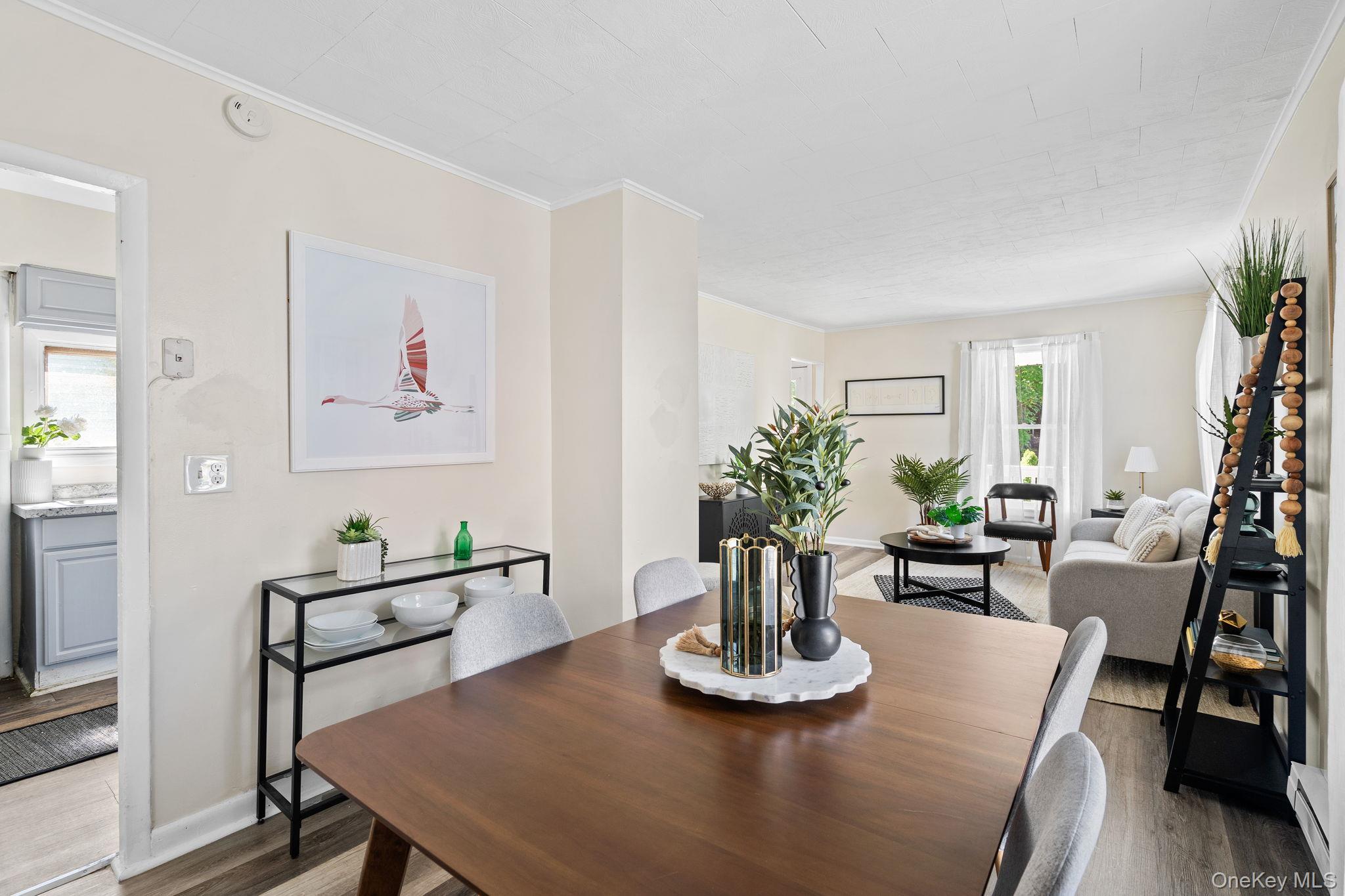 8 Coldenham Road Walden, NY 12586 - Photo 10 of 50 Dining space with wood finished floors, ornamental molding, and a baseboard radiator