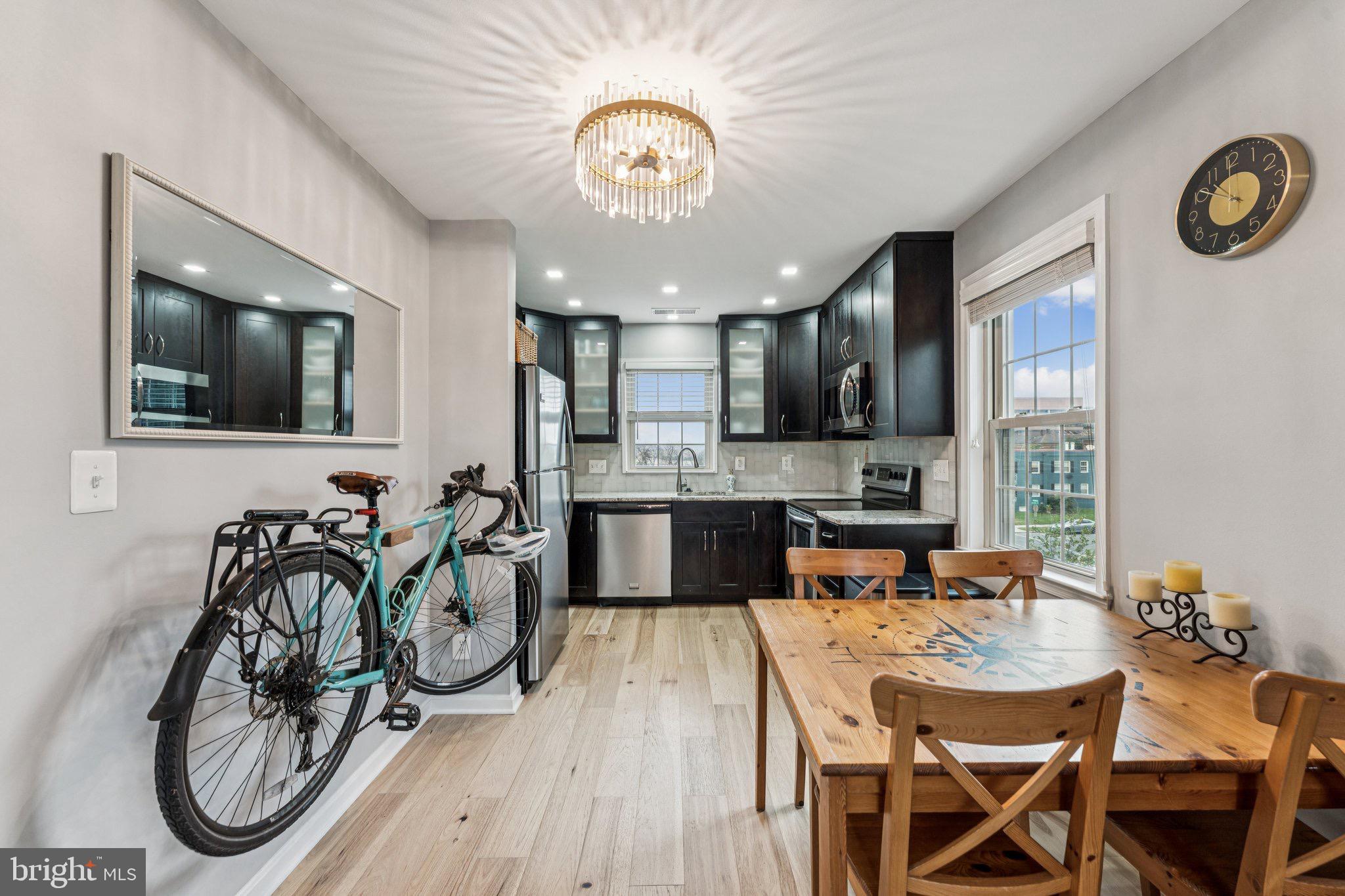 509 Bashford Lane, Unit 6 Alexandria, VA 22314 - Photo 5 of 20 a view of a dining room with furniture kitchen and wooden floor