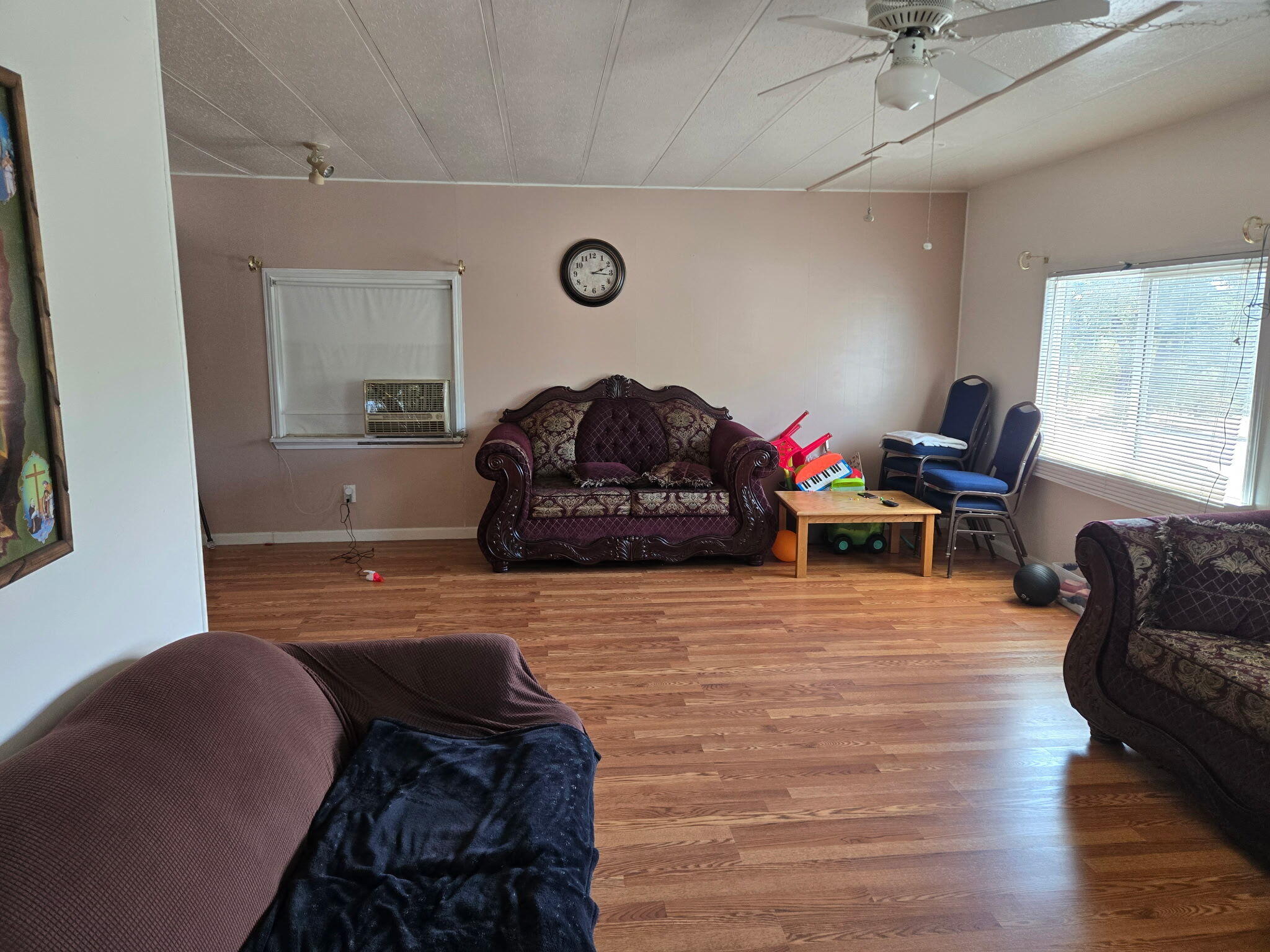 11037 Erickson Way, Unit 71 Redding, CA 96003 - Photo 4 of 13 a living room with furniture and a flat screen tv