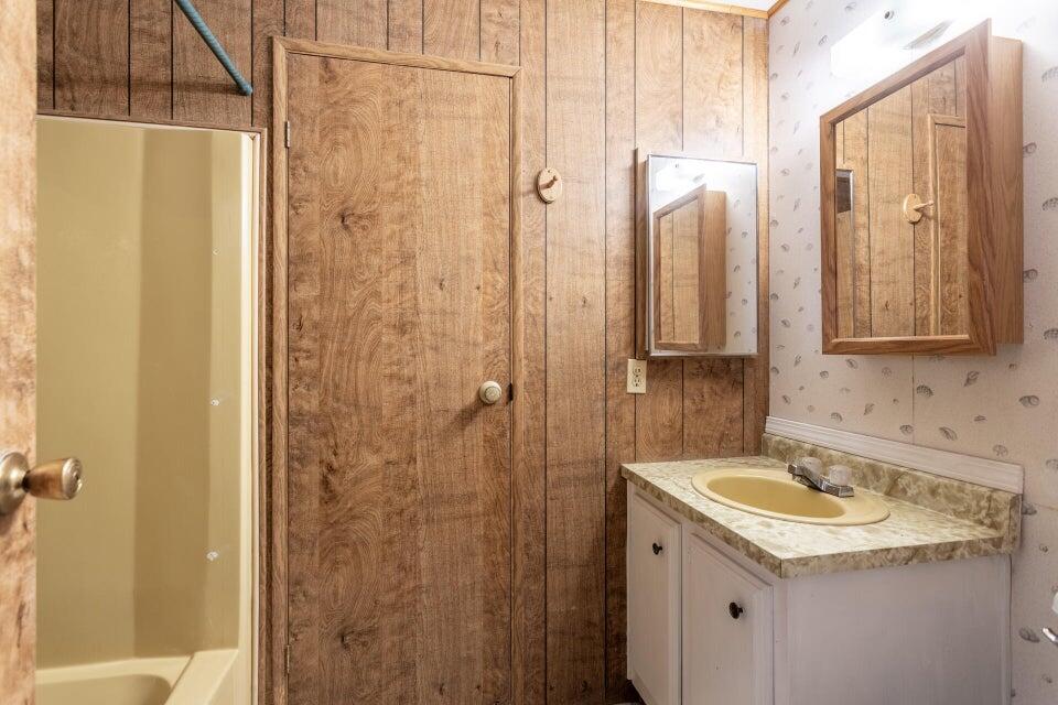 11037 Erickson Way, Unit 71 Redding, CA 96003 - Photo 8 of 13 a bathroom with a sink and a mirror