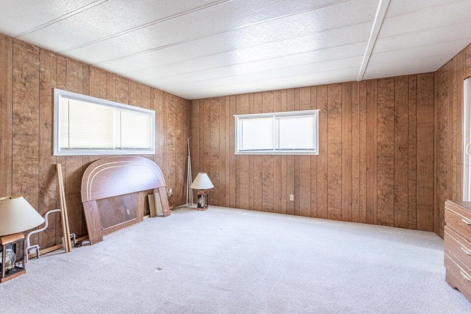 11037 Erickson Way, Unit 71 Redding, CA 96003 - Photo 9 of 13 a view of a livingroom with furniture and windows