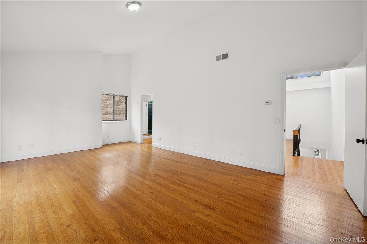 70 Waters Edge, Unit 70 Rye, NY 10580 - Photo 26 of 44 with vaulted ceiling and light wood-style floors