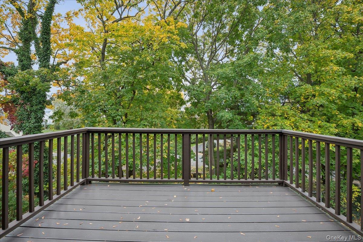 70 Waters Edge, Unit 70 Rye, NY 10580 - Photo 29 of 44 wooden balcony off primary bedroom