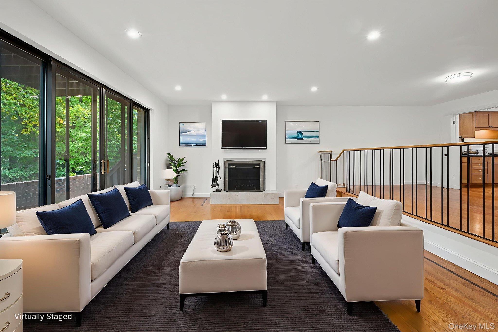 70 Waters Edge, Unit 70 Rye, NY 10580 - Photo 5 of 44 Living room w/fireplace and sliders to deck