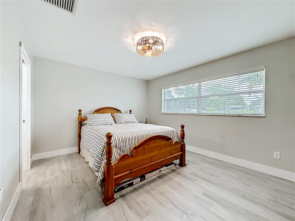 508 Shore Drive Largo, FL 33771 - Photo 14 of 31 a bedroom with a bed and a window