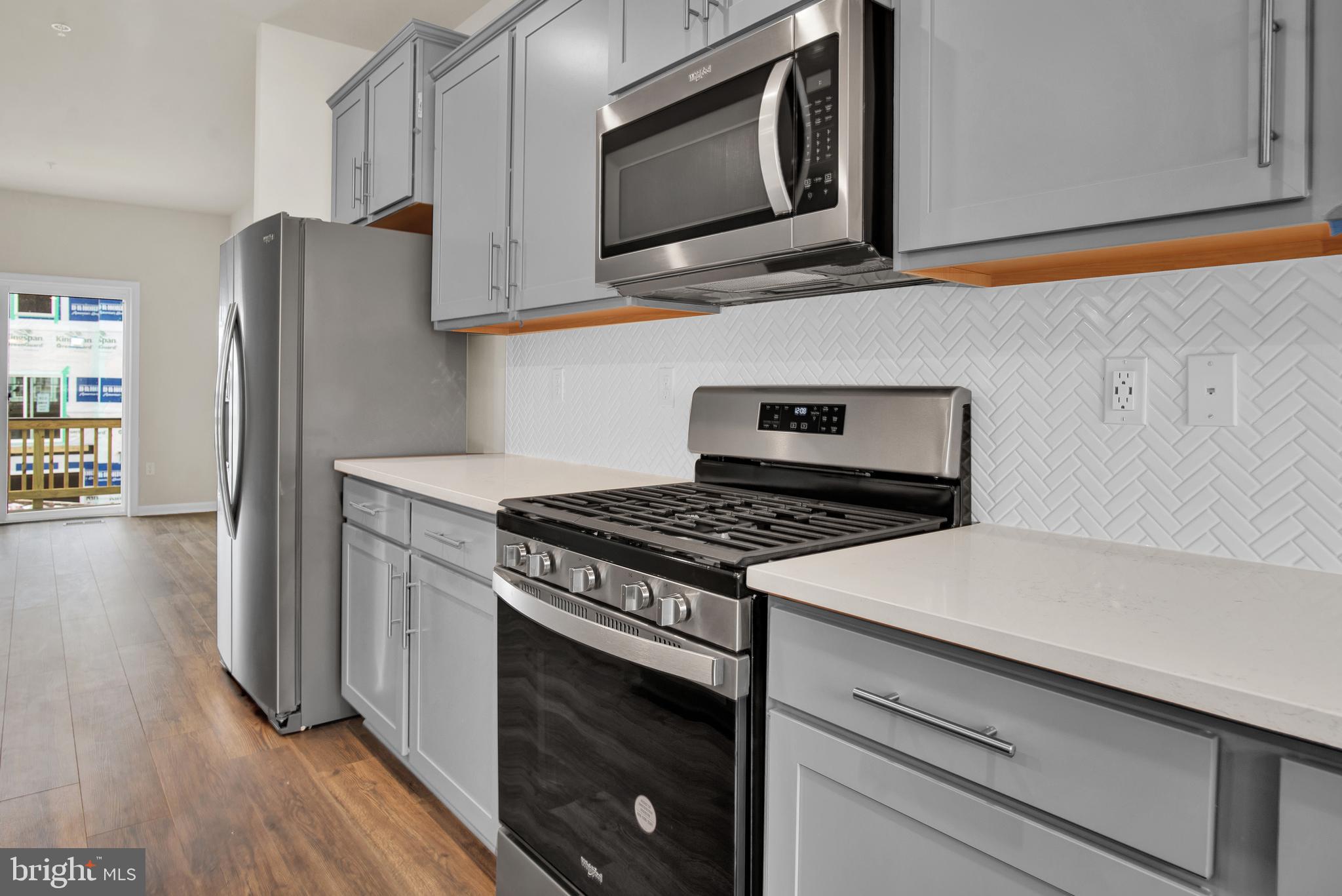 215 Joppa Farm Road Joppa, MD 21085 - Photo 14 of 29 a kitchen with stainless steel appliances a stove microwave and refrigerator
