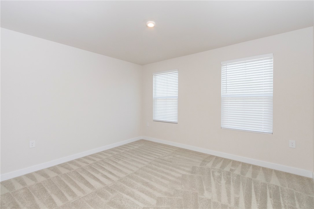 233 Scenic Road Anderson, SC 29621 - Photo 36 of 50 A well-lit, neutral-toned room features clean lines and inviting carpet, ready for personalization.