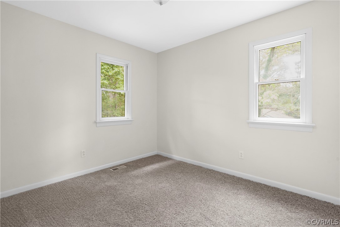 10316 Reams Road Richmond, VA 23236 - Photo 19 of 32 an empty room with a window