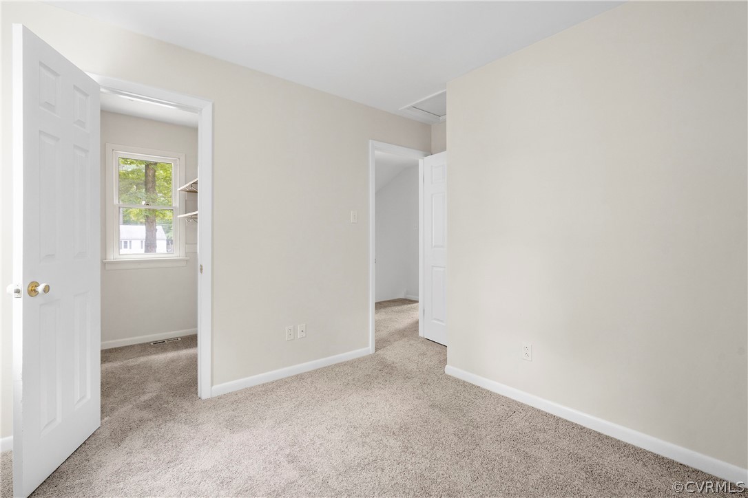 10316 Reams Road Richmond, VA 23236 - Photo 20 of 32 an empty room with windows