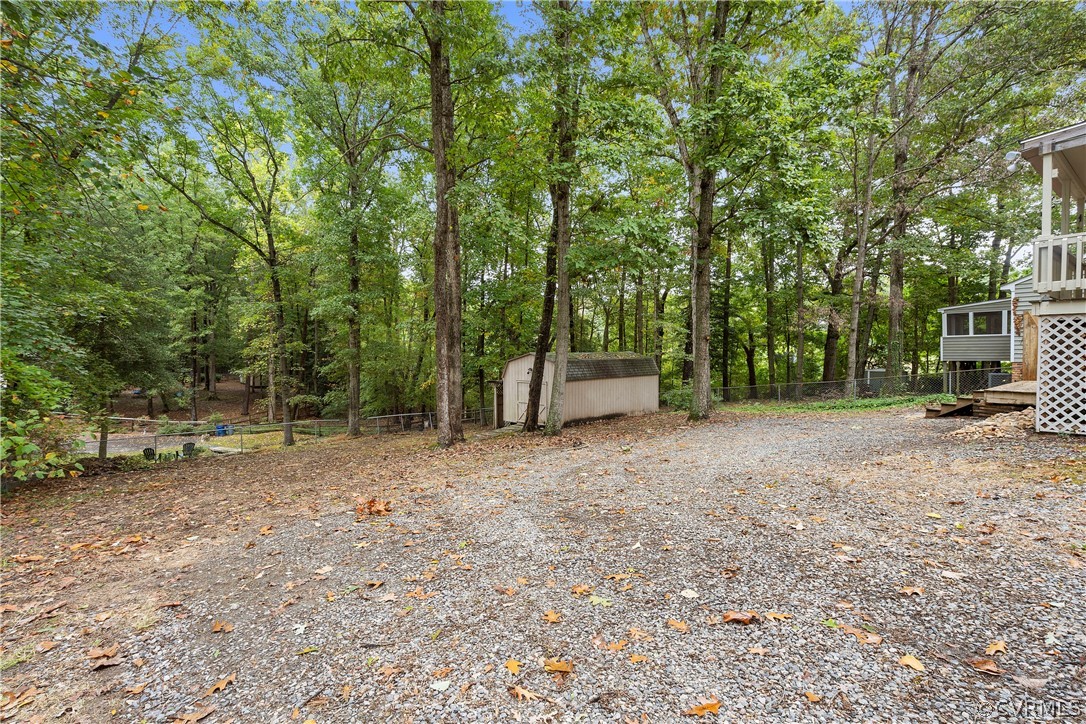 10316 Reams Road Richmond, VA 23236 - Photo 29 of 32 a view of a backyard with large trees