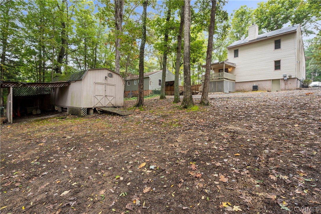 10316 Reams Road Richmond, VA 23236 - Photo 30 of 32 a view of a house with backyard and garden