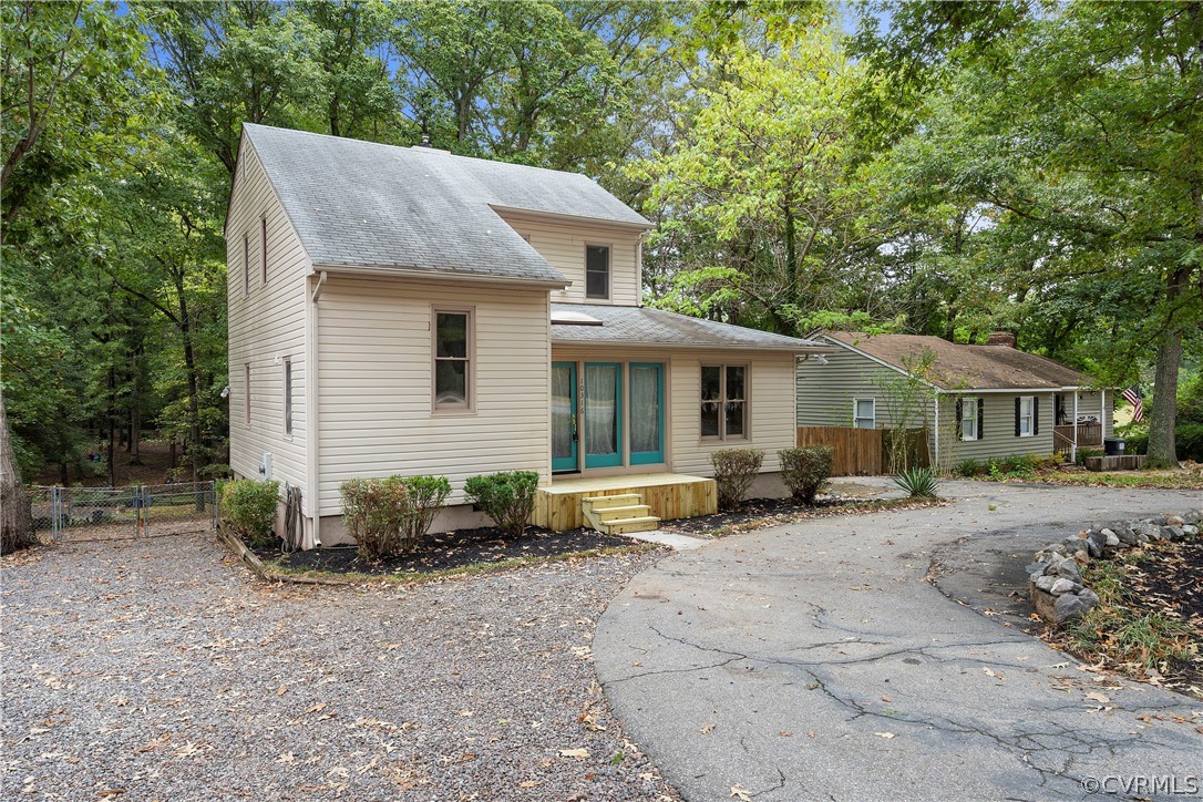 10316 Reams Road Richmond, VA 23236 - Photo 3 of 32 a front view of a house with garden