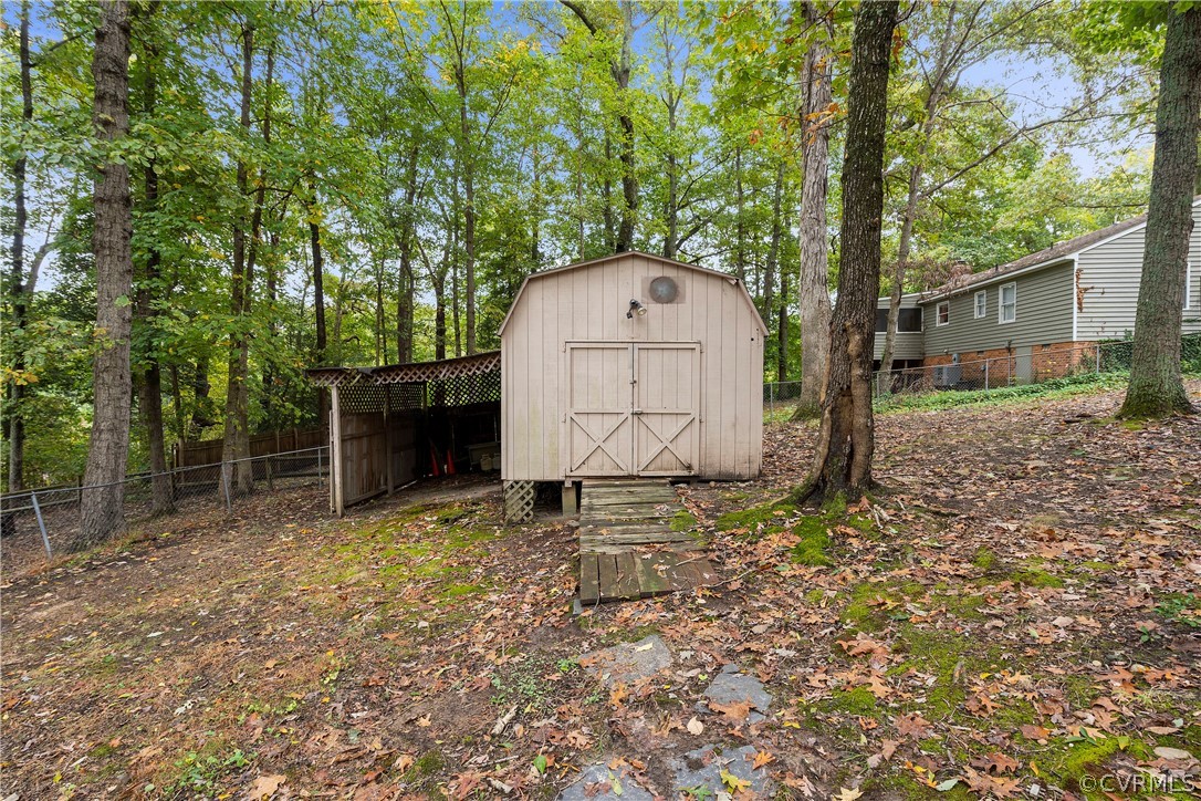 10316 Reams Road Richmond, VA 23236 - Photo 31 of 32 a house with tall trees