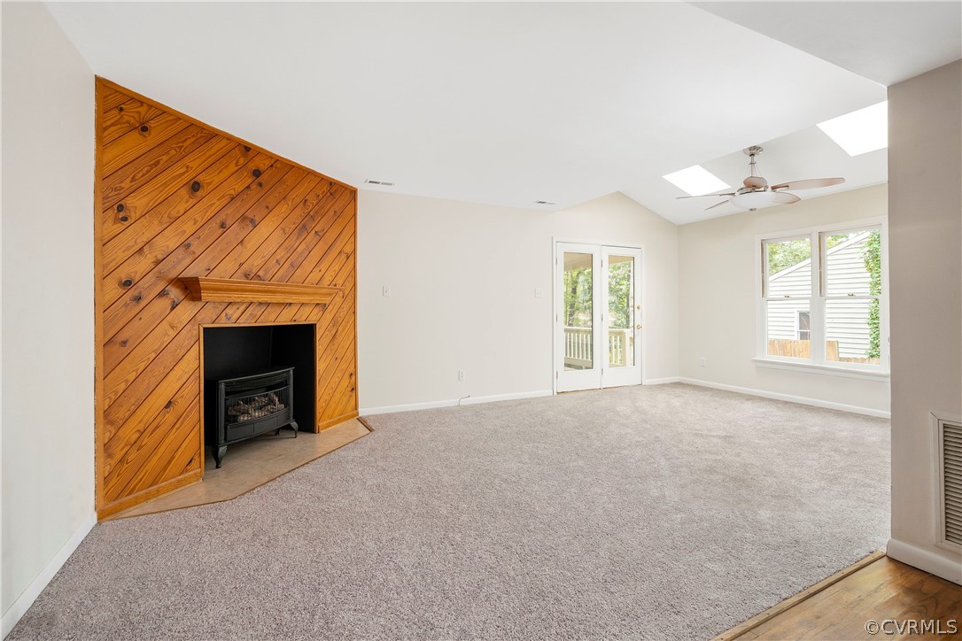 10316 Reams Road Richmond, VA 23236 - Photo 6 of 32 an empty room with windows and fireplace