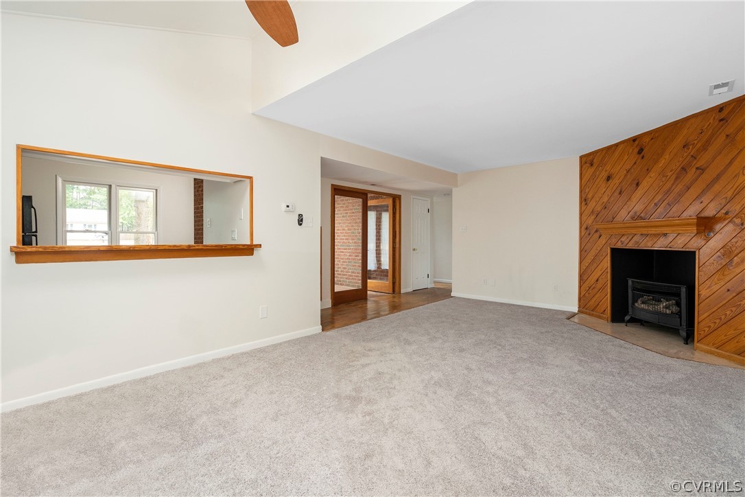 10316 Reams Road Richmond, VA 23236 - Photo 8 of 32 a view of a livingroom with an empty space and a fireplace
