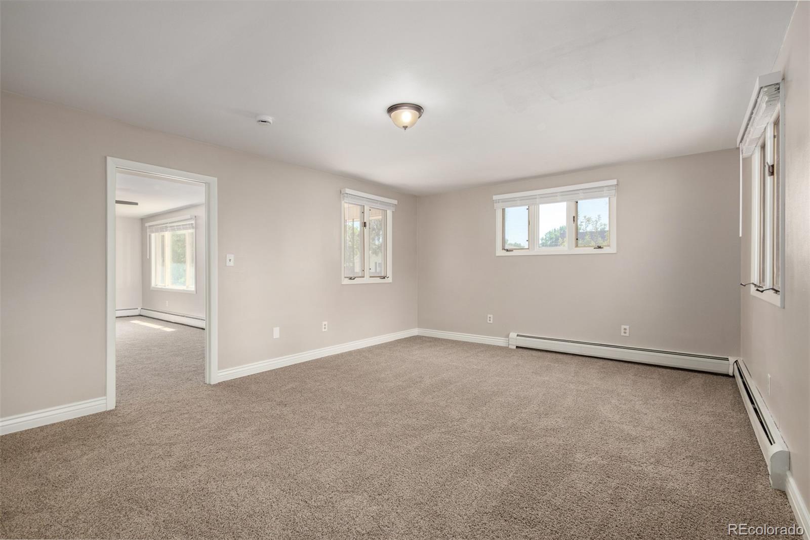 117 6th Street Frederick, CO 80530 - Photo 14 of 43 an empty room with windows and closet