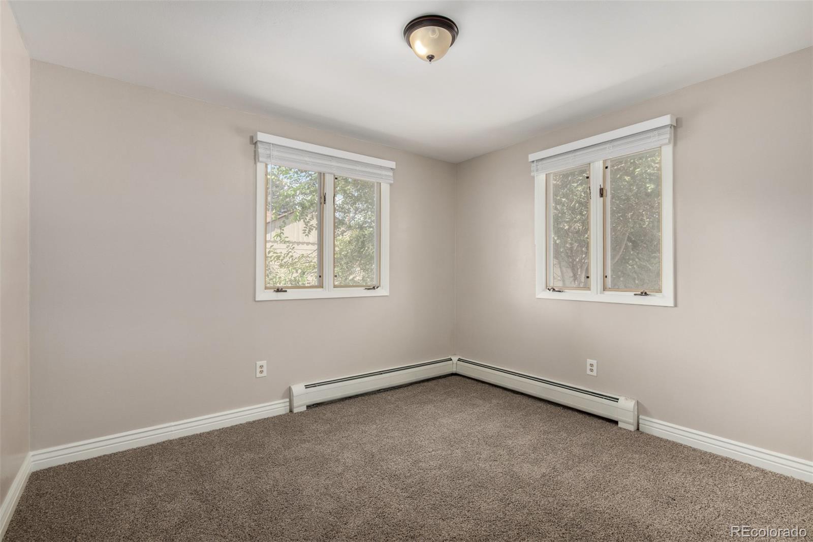 117 6th Street Frederick, CO 80530 - Photo 16 of 43 an empty room with a window