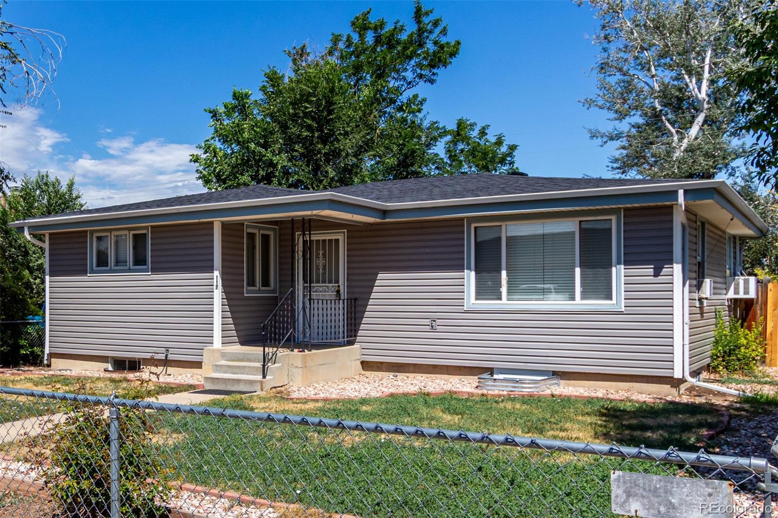 117 6th Street Frederick, CO 80530 - Photo 3 of 43 a front view of house with yard