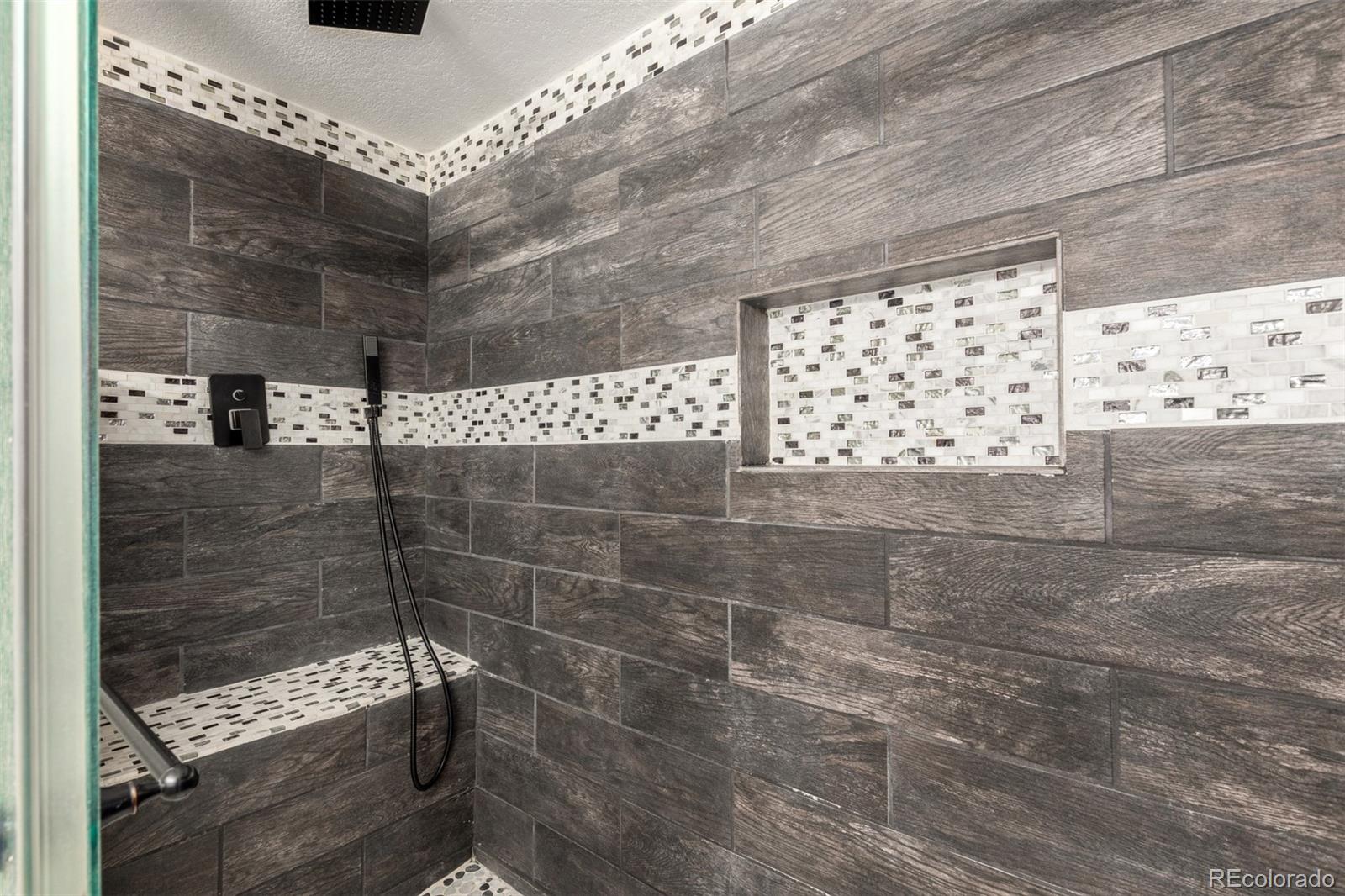 117 6th Street Frederick, CO 80530 - Photo 31 of 43 a bathroom with a shower