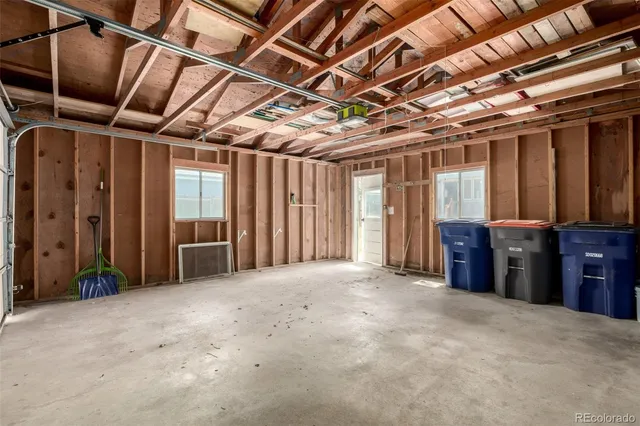a view of a house with a yard and a tree