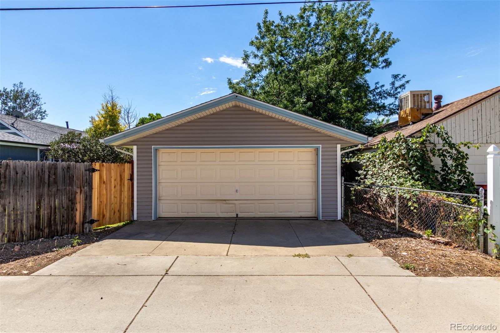 117 6th Street Frederick, CO 80530 - Photo 38 of 43 a front view of a house with a garage