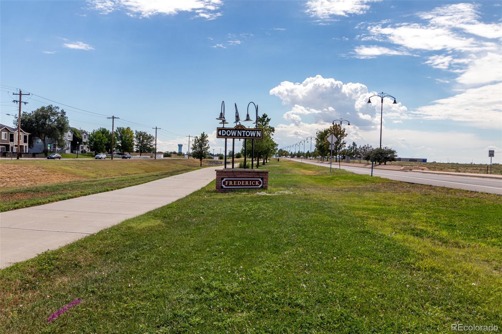 117 6th Street Frederick, CO 80530 - Photo 41 of 43 a front view of a house with a garden and trees