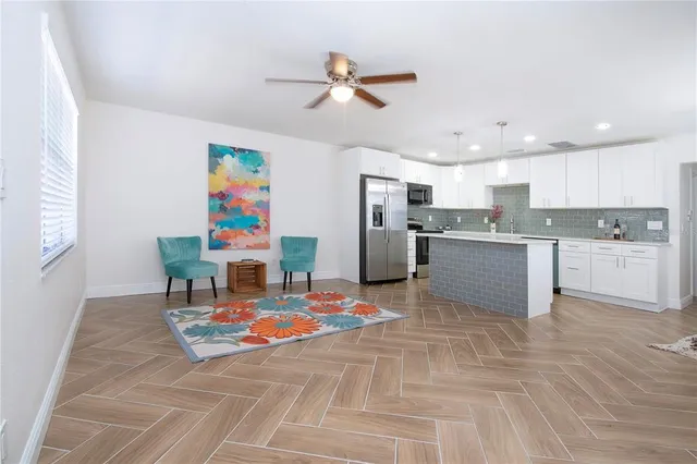 a kitchen with a sink stainless steel appliances and cabinets