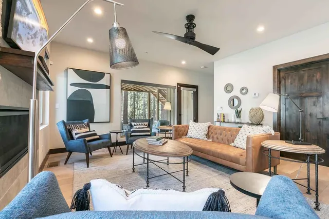 a living room with furniture and wooden floor