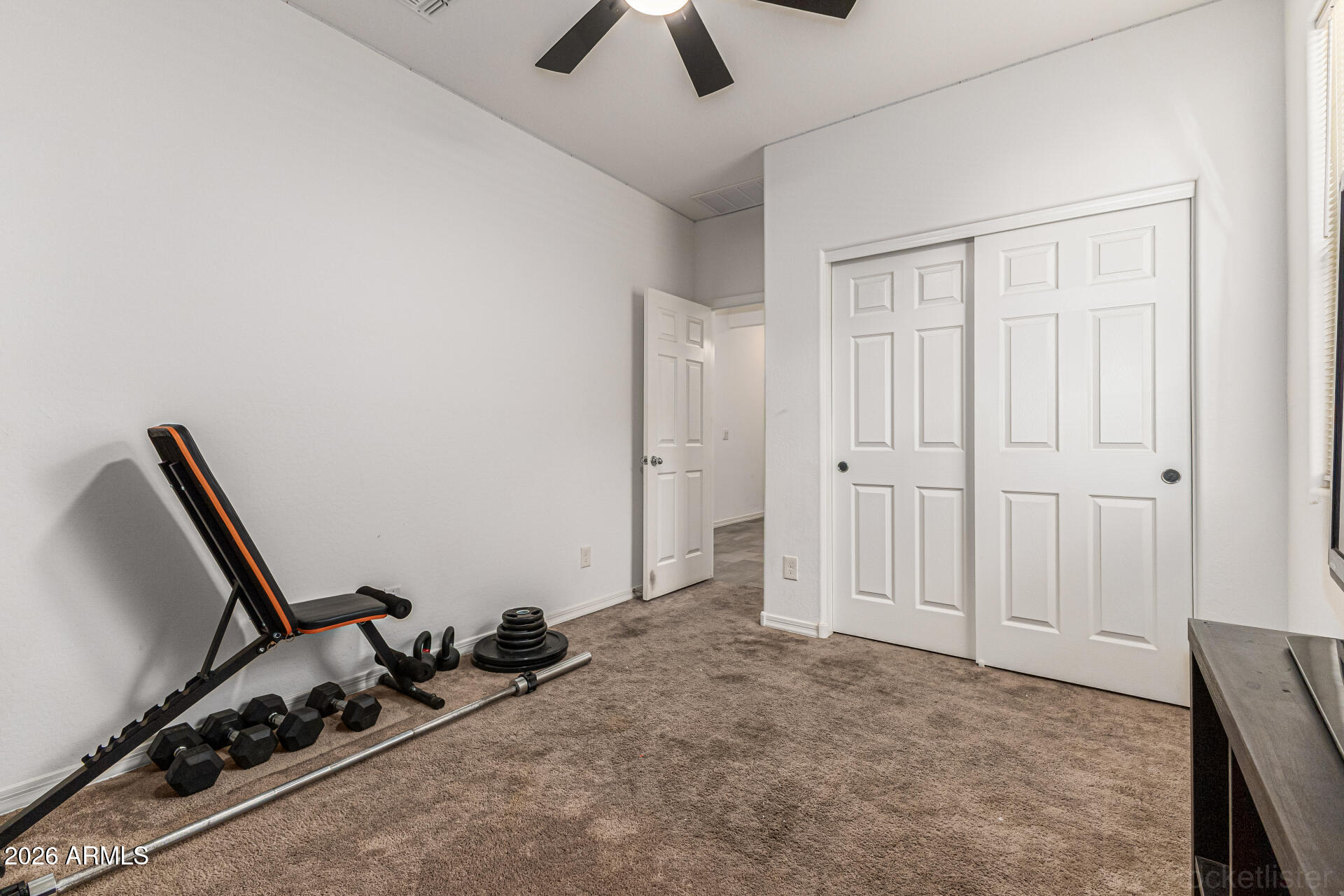 Undisclosed Address Avondale, AZ 85323 - Photo 19 of 32 a view of a room with gym equipment