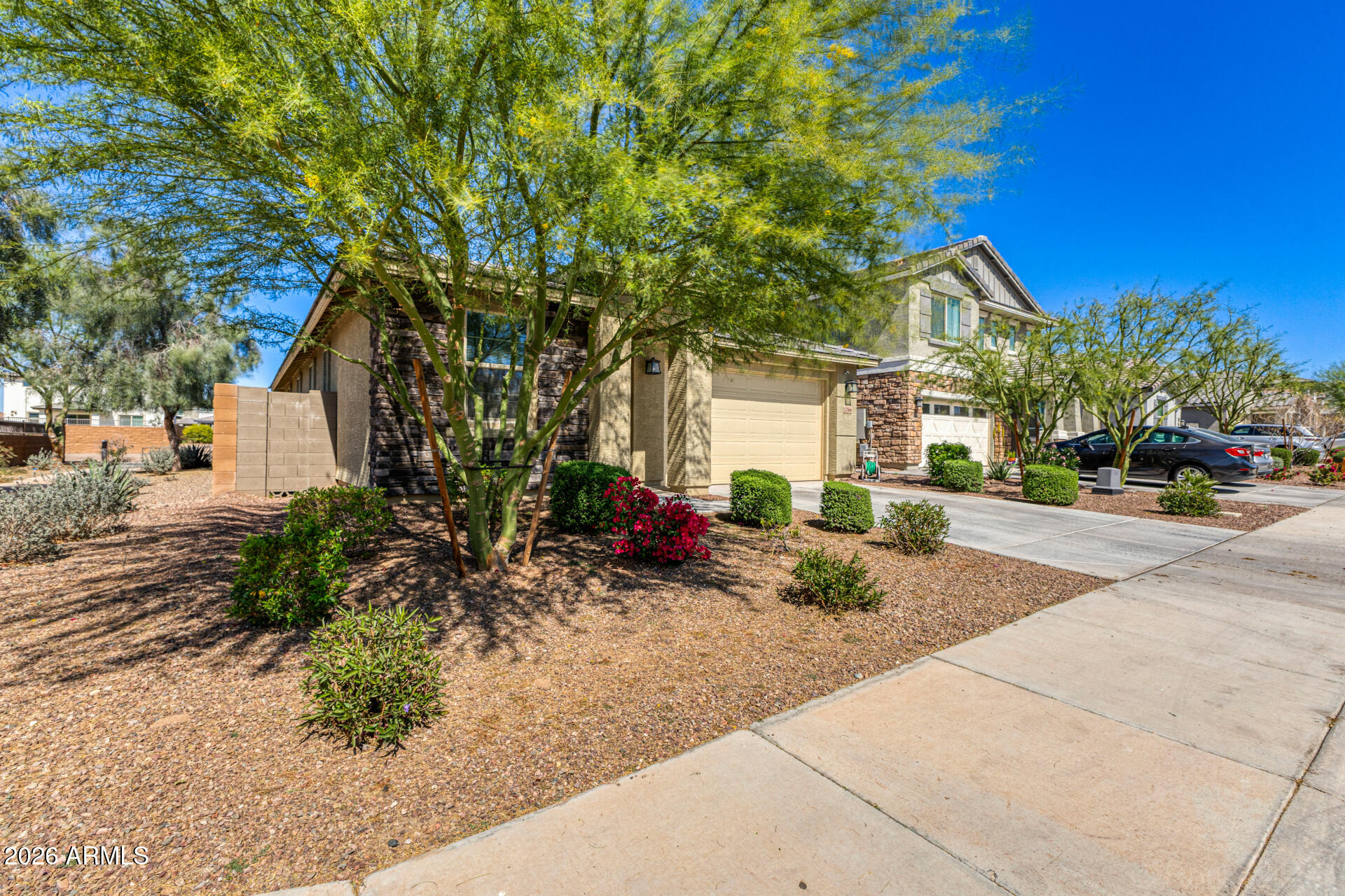 Undisclosed Address Avondale, AZ 85323 - Photo 2 of 32 a view of a parked cars in front of house