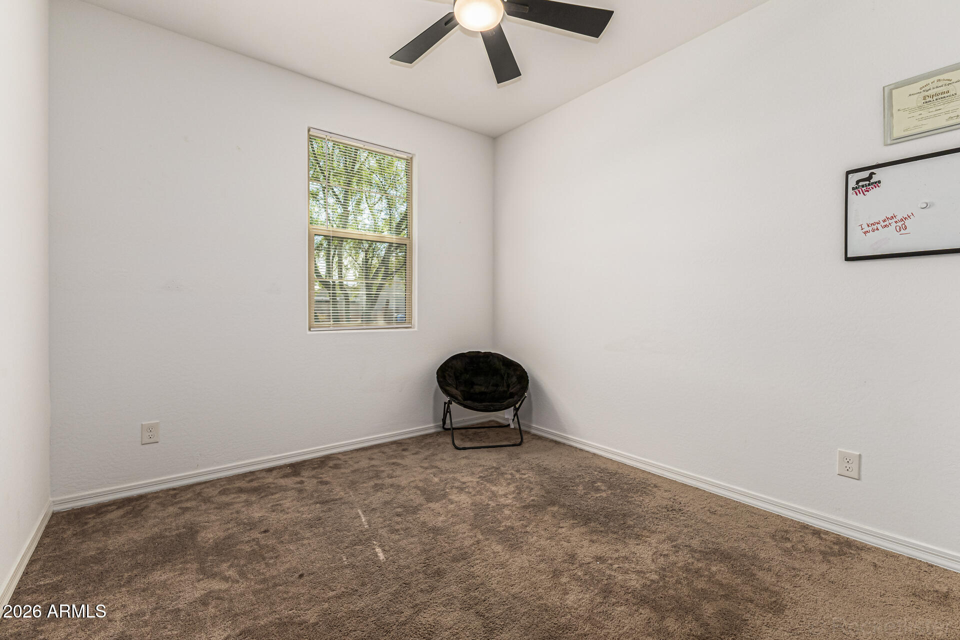 Undisclosed Address Avondale, AZ 85323 - Photo 21 of 32 an empty room with windows and fan