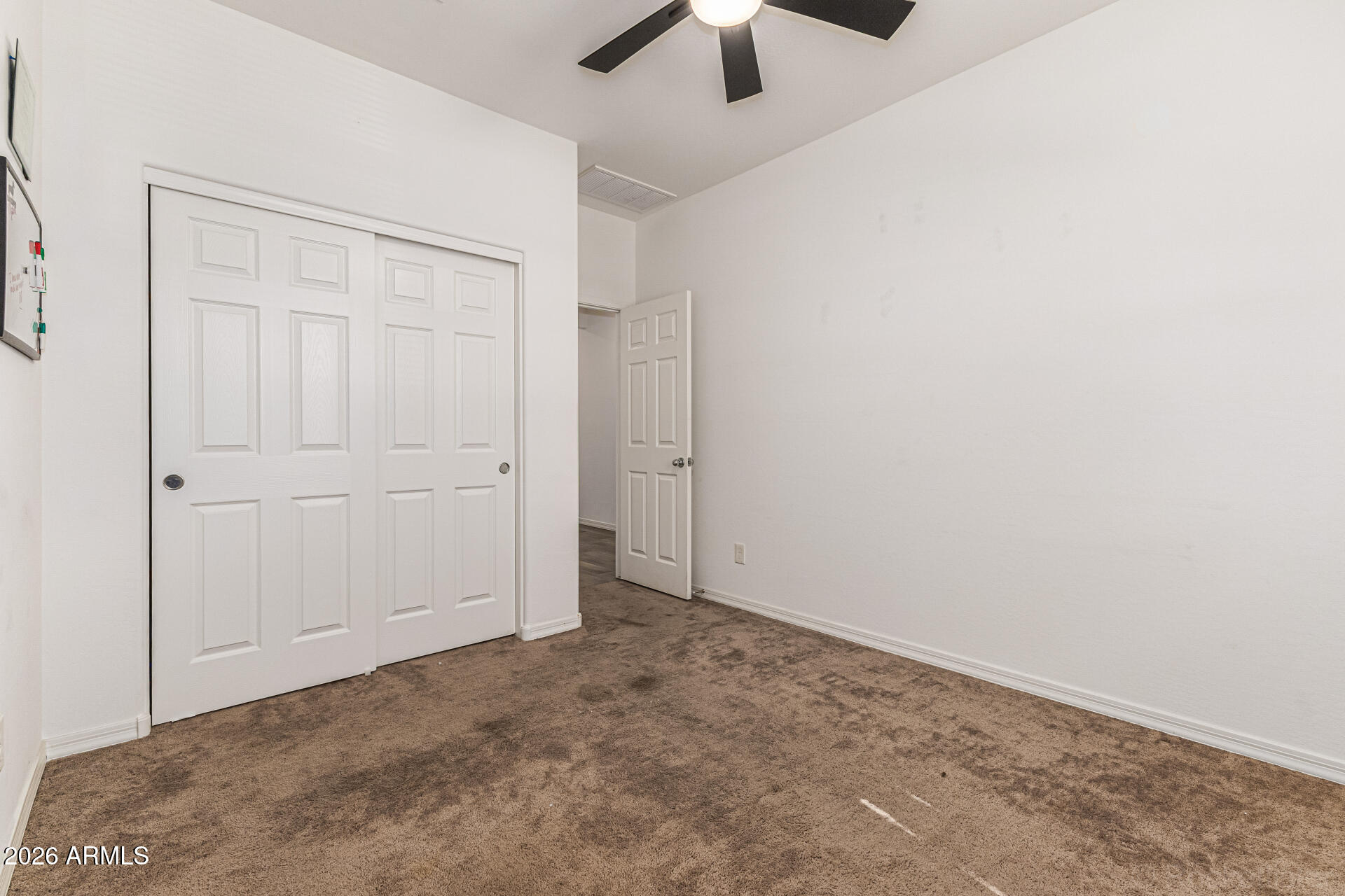 Undisclosed Address Avondale, AZ 85323 - Photo 22 of 32 an empty room with ceiling fan