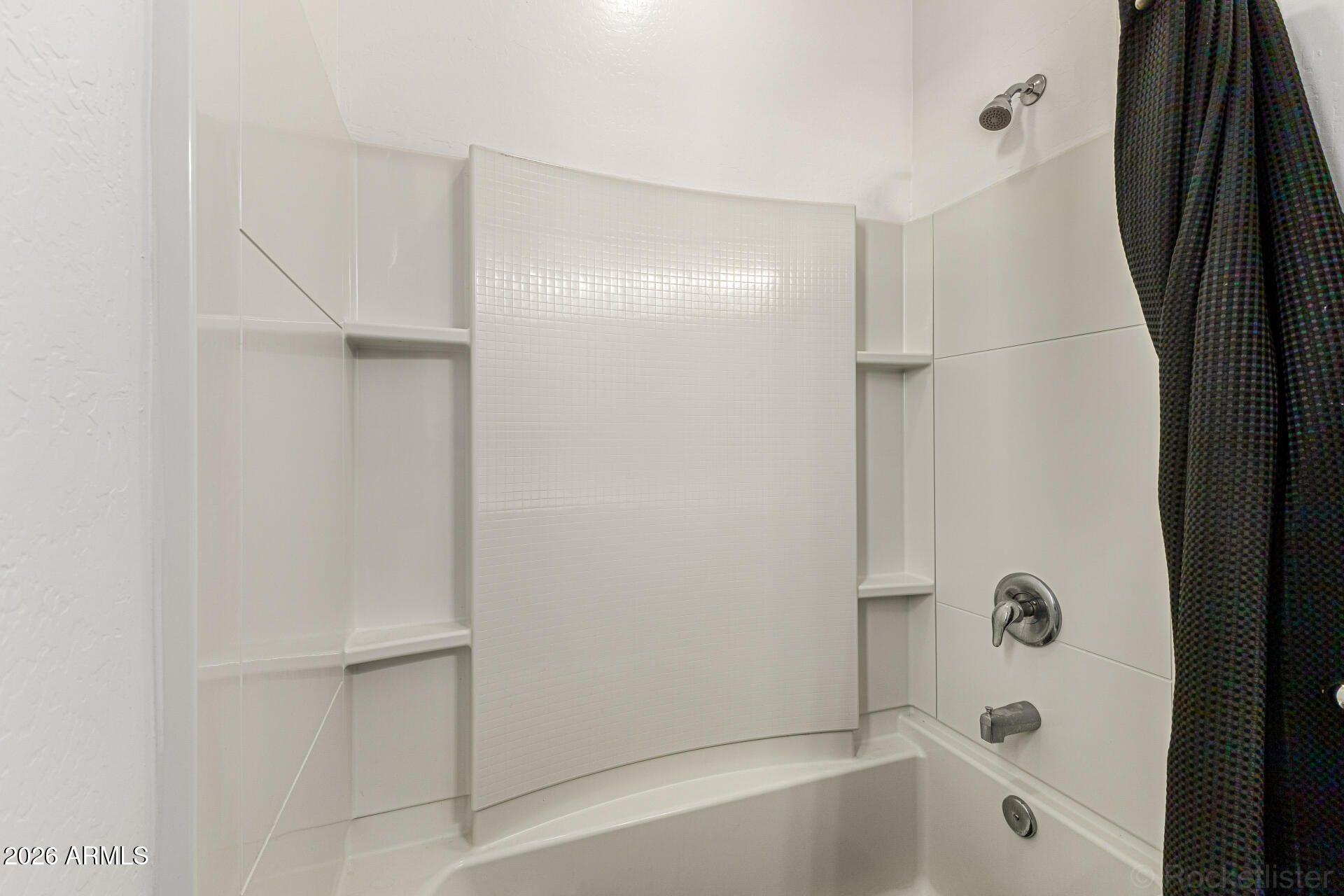 Undisclosed Address Avondale, AZ 85323 - Photo 24 of 32 a bathroom with a bathtub