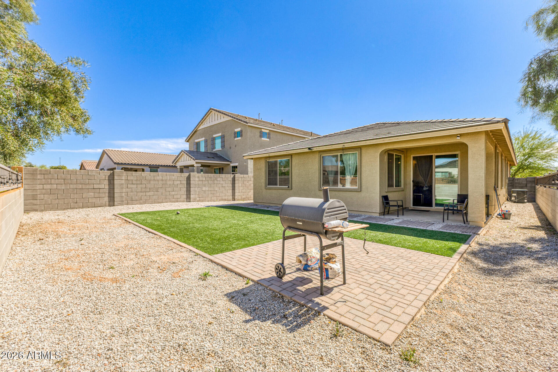 Undisclosed Address Avondale, AZ 85323 - Photo 29 of 32 a view of a house with a patio