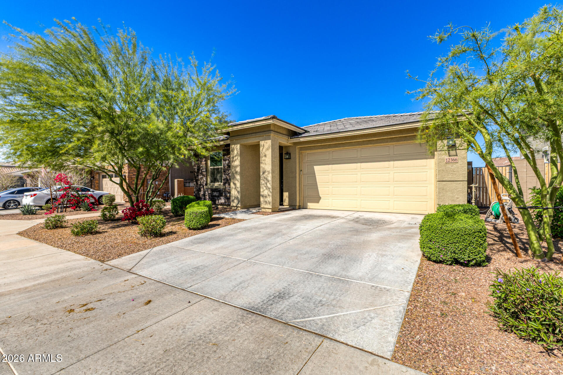 Undisclosed Address Avondale, AZ 85323 - Photo 3 of 32 a front view of a house with a yard