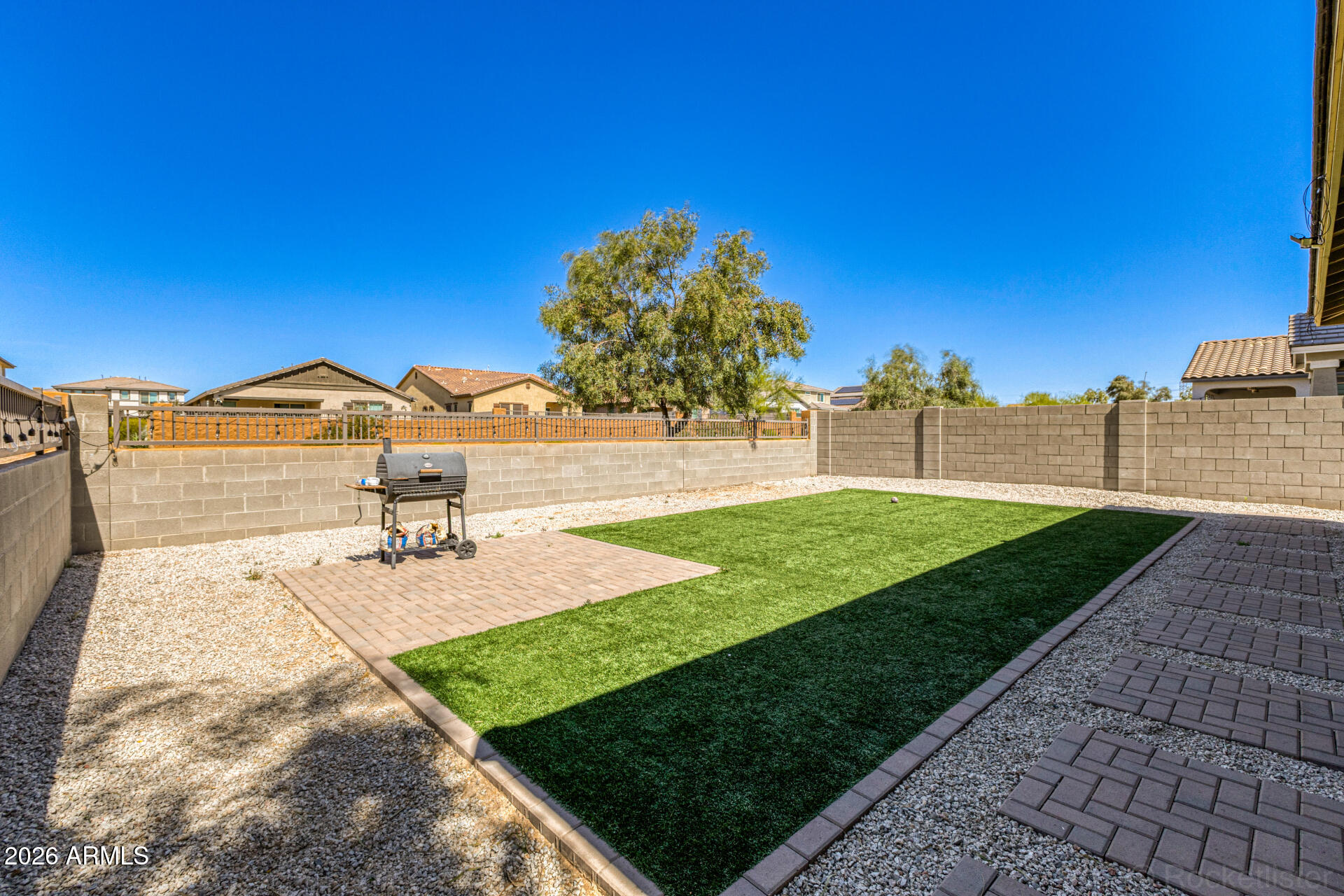 Undisclosed Address Avondale, AZ 85323 - Photo 32 of 32 a view of a backyard with a garden