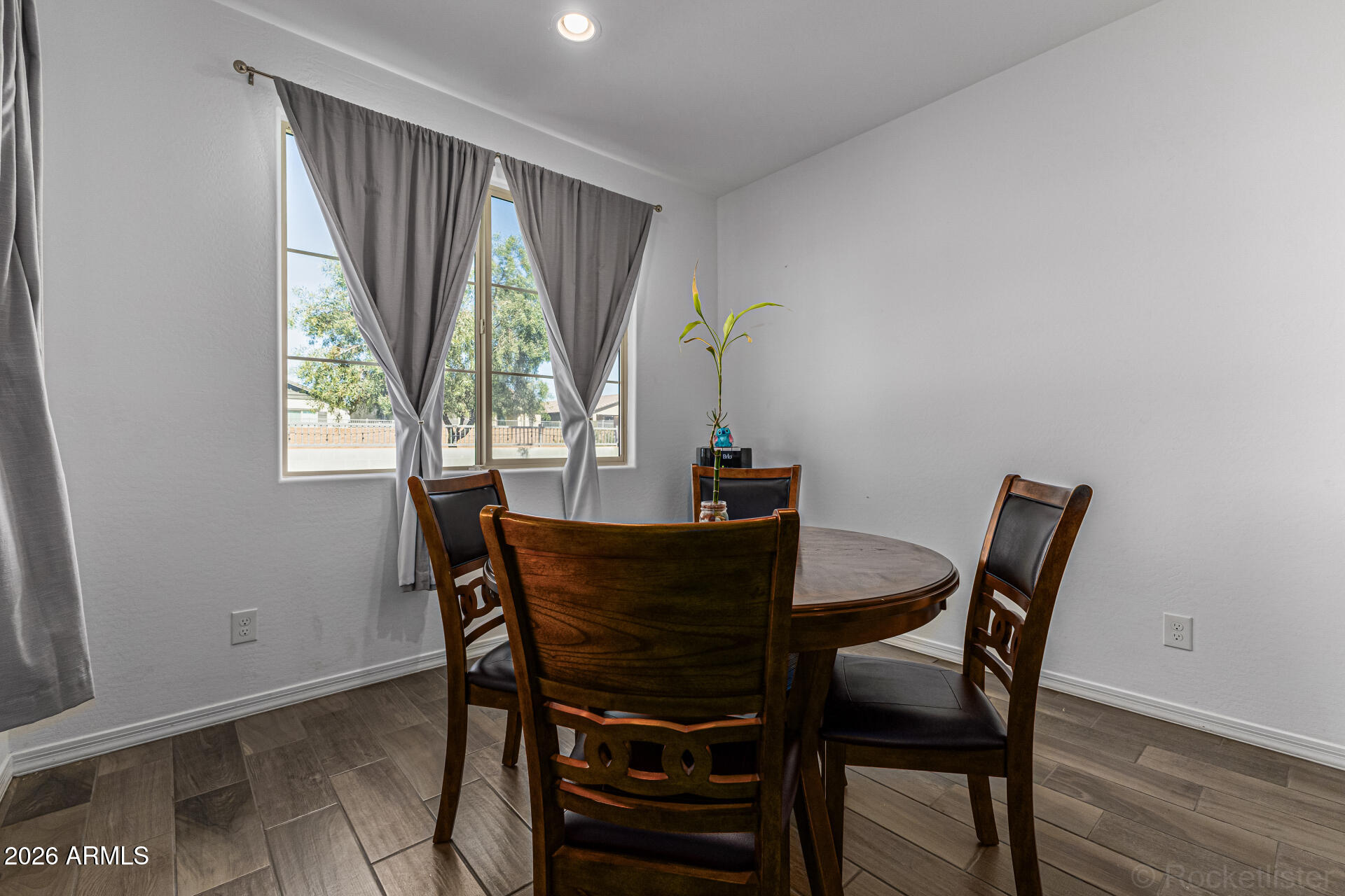 Undisclosed Address Avondale, AZ 85323 - Photo 10 of 32 a view of a dining room with furniture and window
