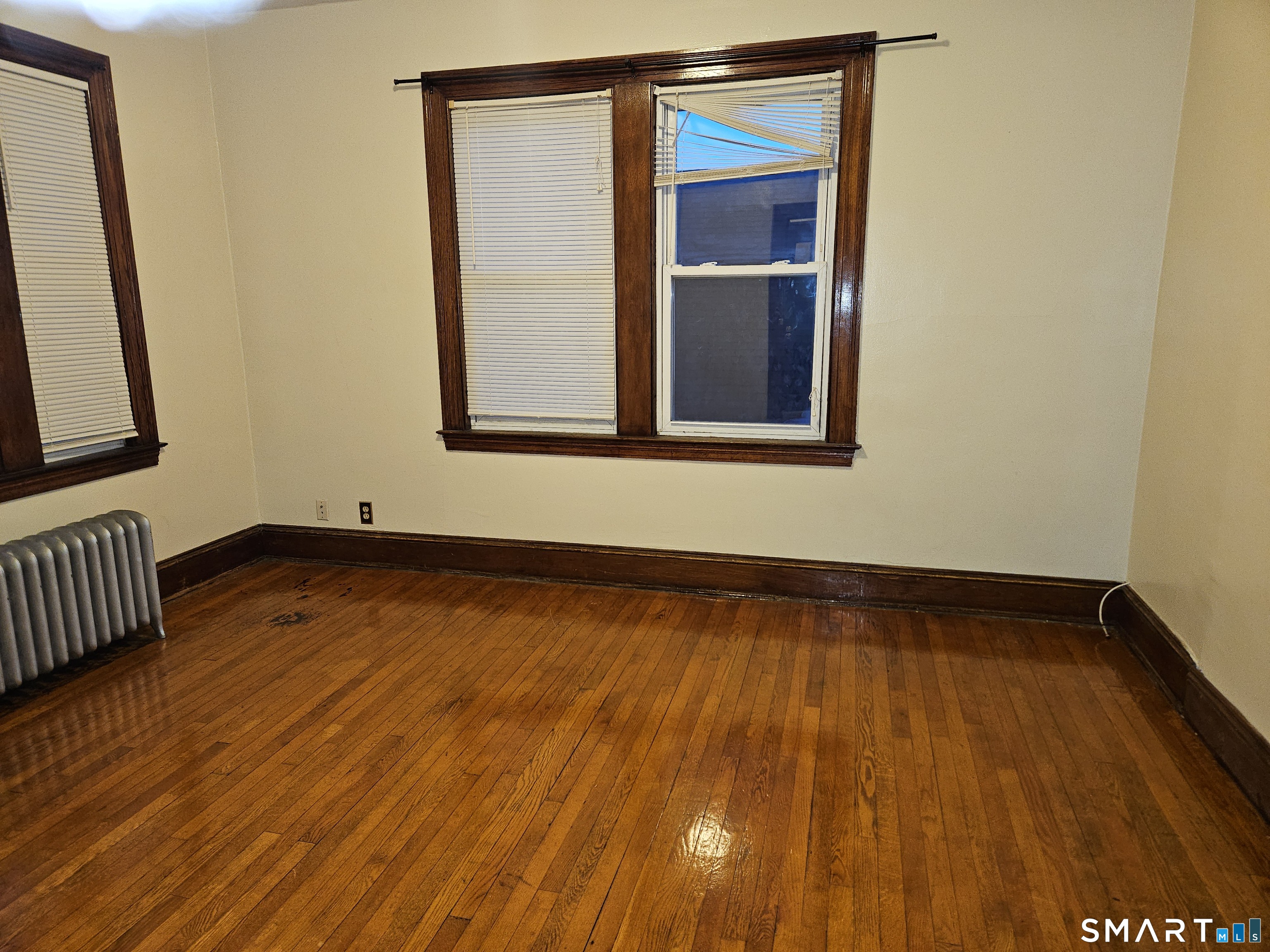 103 Kent Street Hartford, CT 06112 - Photo 2 of 9 a view of a room with wooden floor and small door
