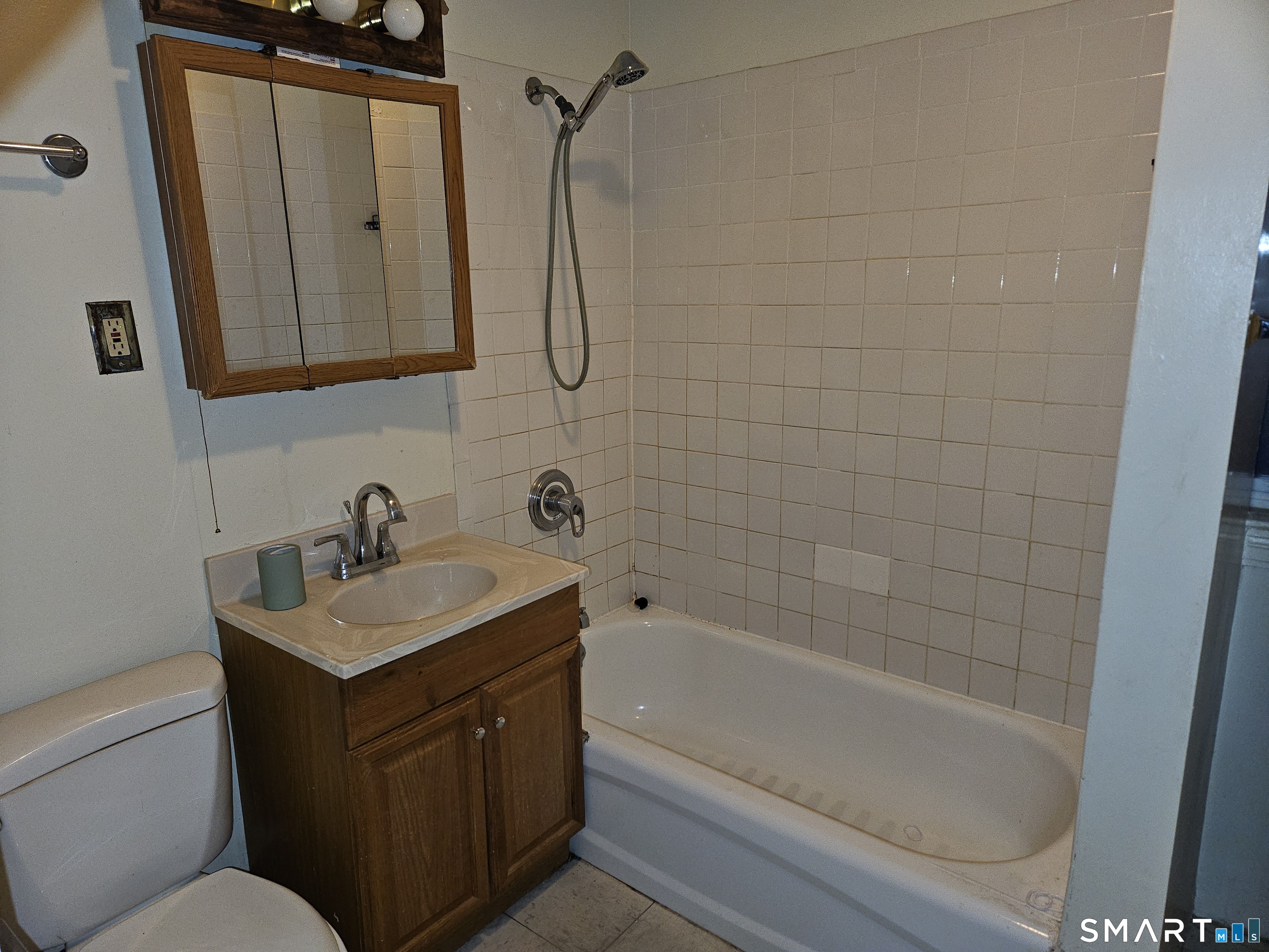 103 Kent Street Hartford, CT 06112 - Photo 3 of 9 a bathroom with a granite countertop sink toilet and shower