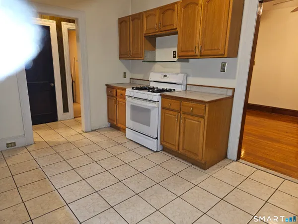 a kitchen with stainless steel appliances a sink and a refrigerator