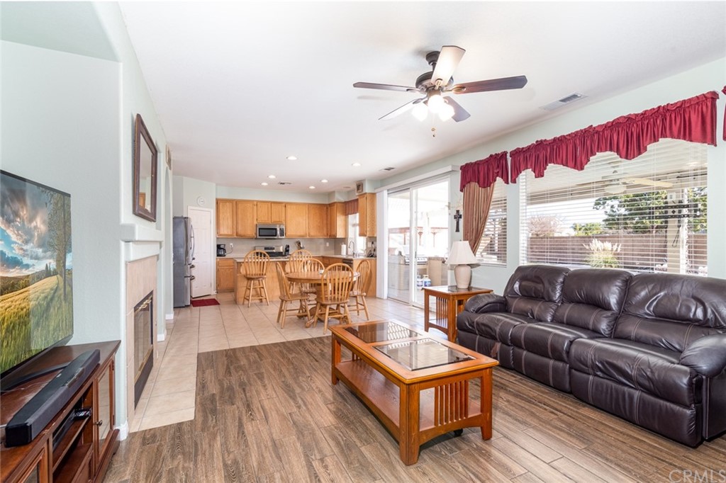 23746 Fieldcrest Lane Murrieta, CA 92562 - Photo 18 of 54 a living room with furniture and a flat screen tv
