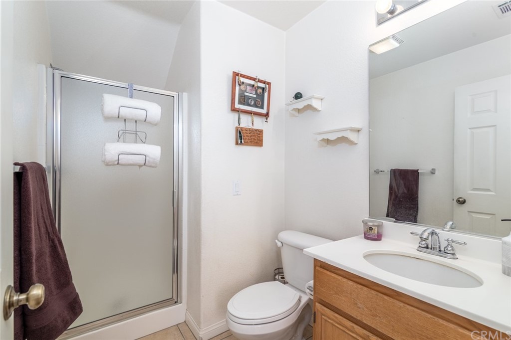 23746 Fieldcrest Lane Murrieta, CA 92562 - Photo 25 of 54 a bathroom with a sink a toilet and shower