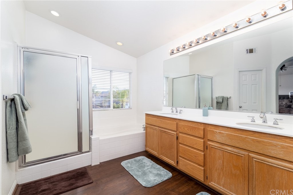 23746 Fieldcrest Lane Murrieta, CA 92562 - Photo 32 of 54 a spacious bathroom with a double vanity sink a mirror and a bathtub