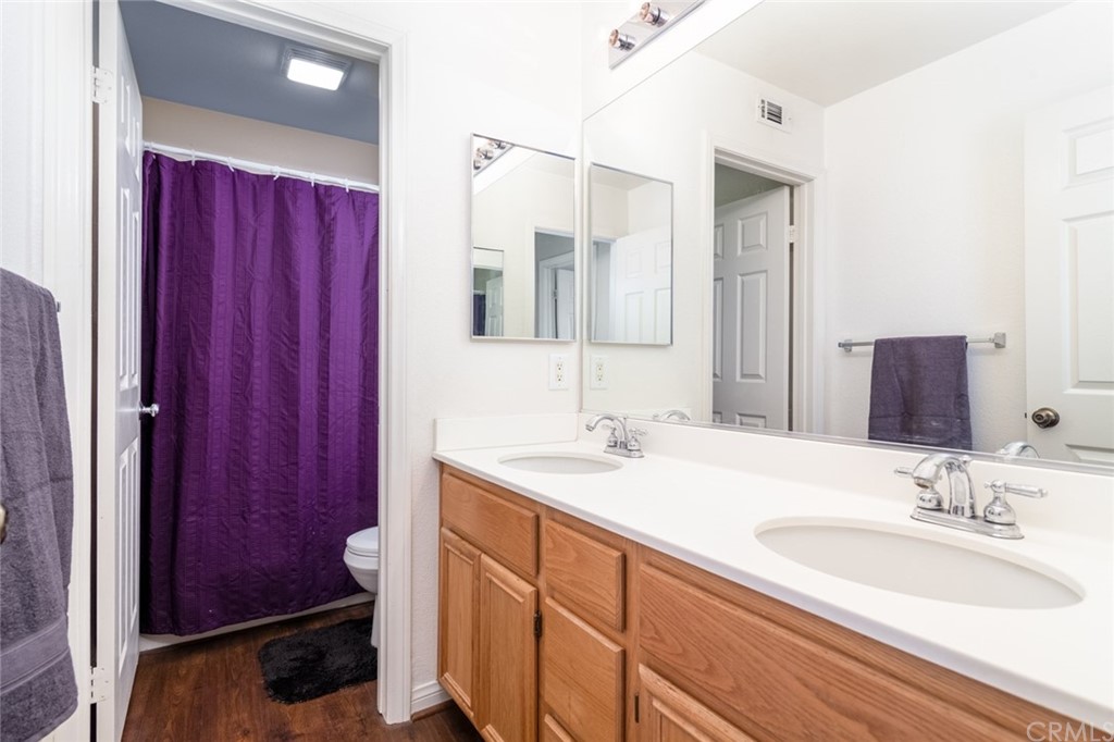 23746 Fieldcrest Lane Murrieta, CA 92562 - Photo 35 of 54 a bathroom with a granite countertop sink and a mirror