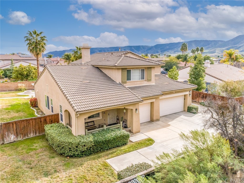 23746 Fieldcrest Lane Murrieta, CA 92562 - Photo 54 of 54 a front view of a house with a yard and potted plants