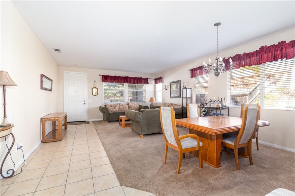 23746 Fieldcrest Lane Murrieta, CA 92562 - Photo 7 of 54 a living room with furniture a window and a table